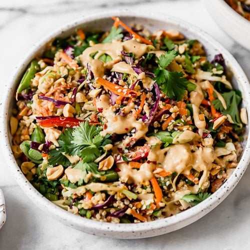 Thai Peanut Quinoa Salad Served in a White Stone Bowl