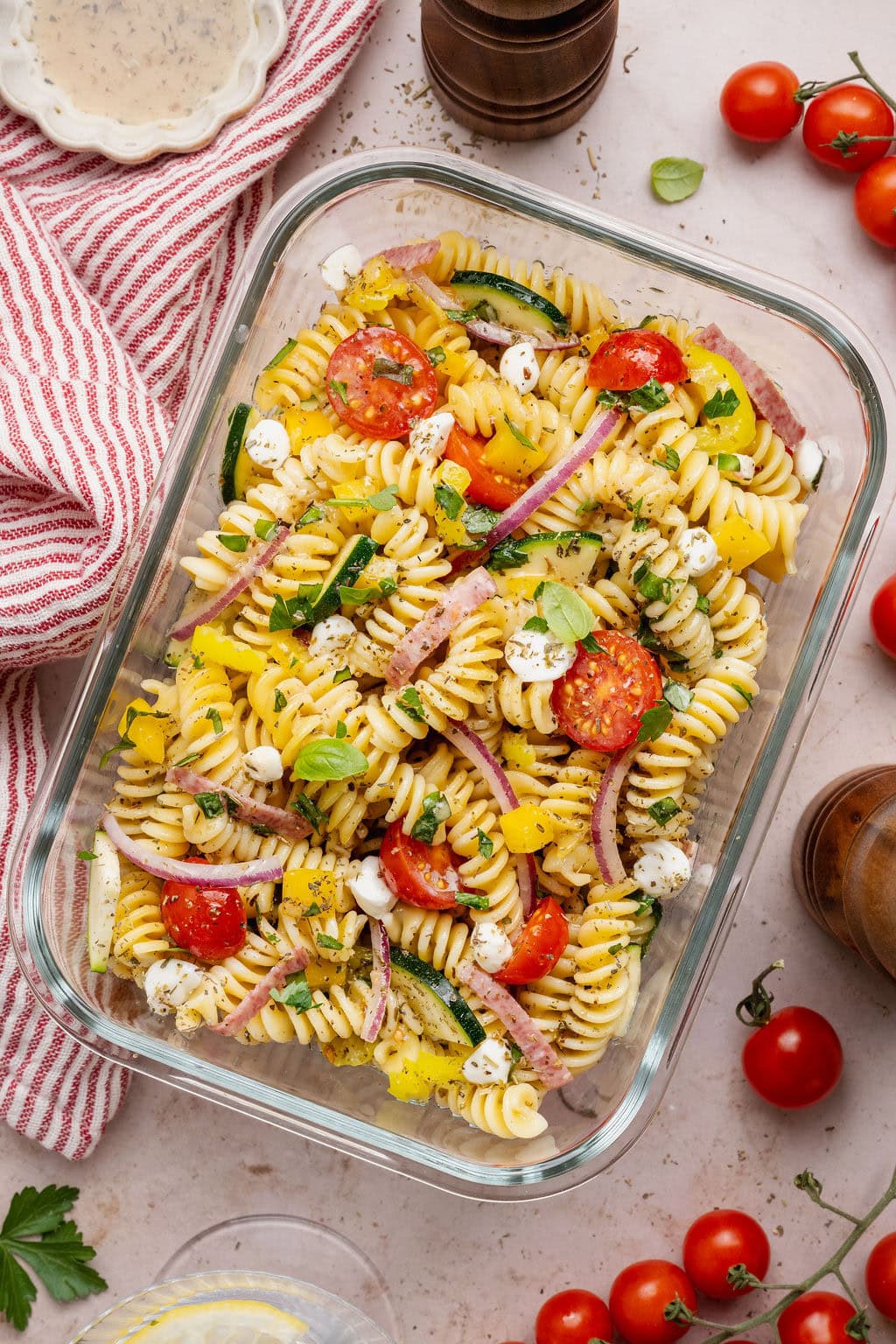 Overhead view of a glass meal prep container filled with Zesty Italian Pasta Salad.