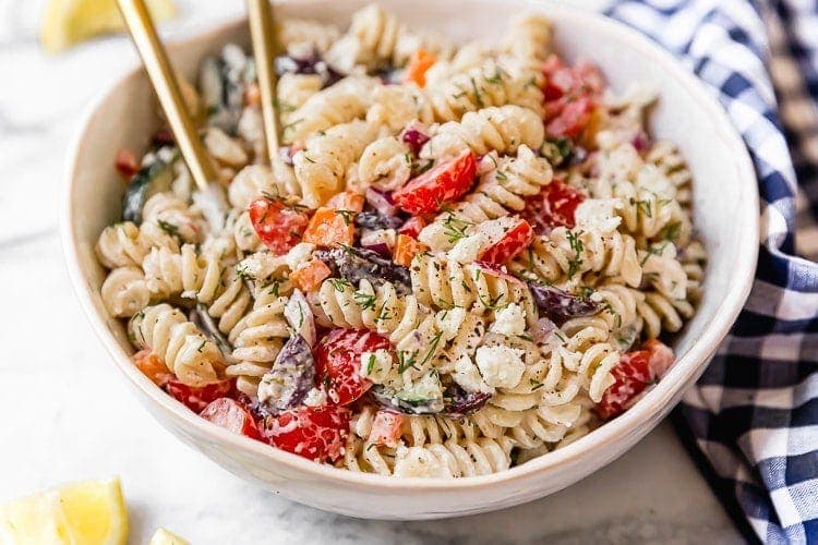 Close up view Greek veggie pasta salad with creamy yogurt dressing
