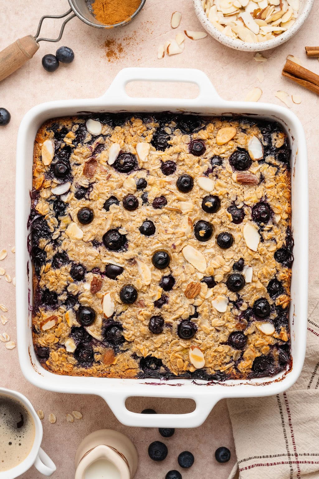 Overhead view of a white baking dish filled with freshly baked blueberry baked oatmeal.