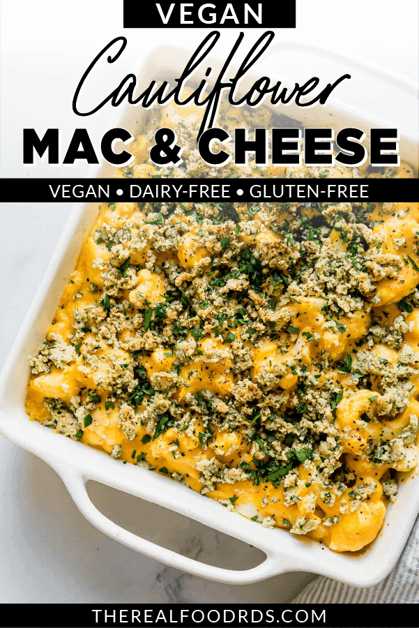 Creamy Vegan Cauliflower Mac and Cheese in a white baking dish with a cashew and herb topping.