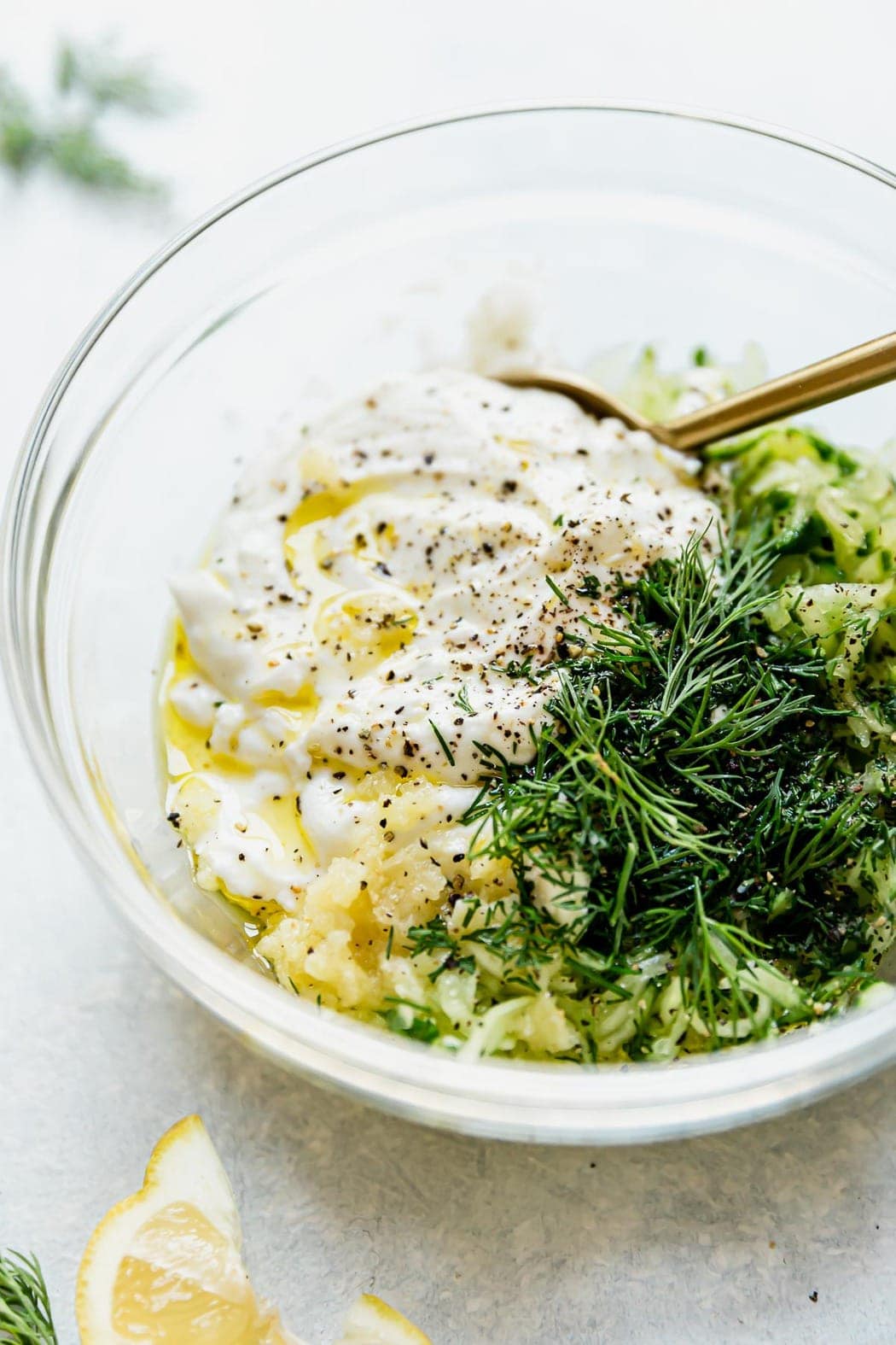 Tzatziki ingredients in a small bowl before being mixed. Topping for the Mediterranean Bowls.