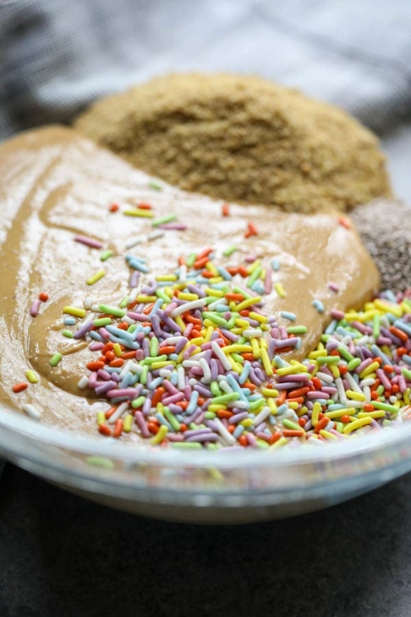 all the ingredients for no bake energy bites in a bowl to be mixed