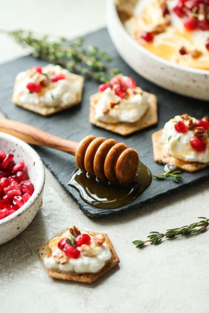 Honey on a black serving board.