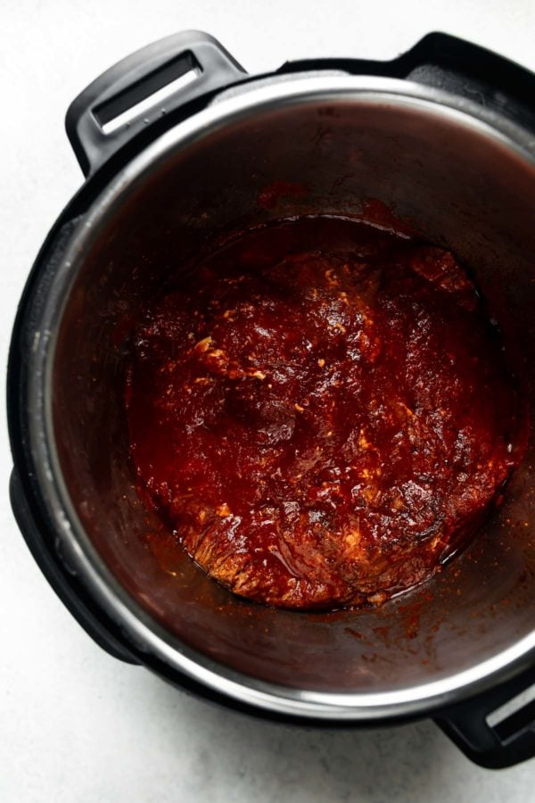 Overhead view of inside an Instant Pot with barbecue Brisket cooked down