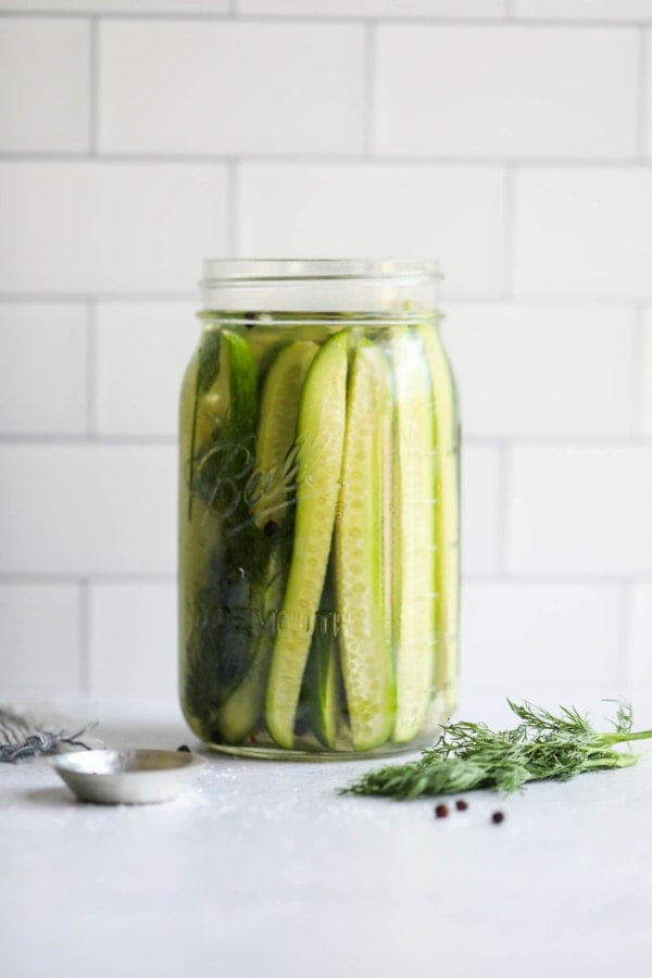 A jar of refrigerator pickles on a counter