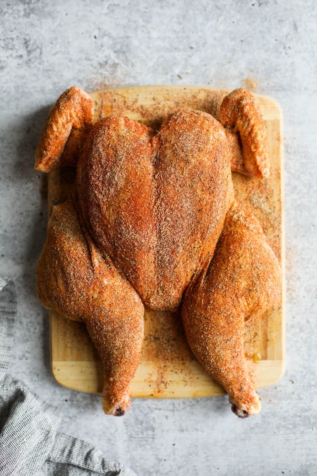 Dry rub rubbed liberally over a spatchcock chicken