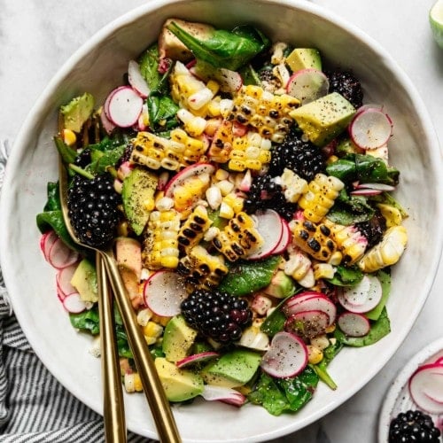 Grilled Corn Salad with Blackberries in a white bowl