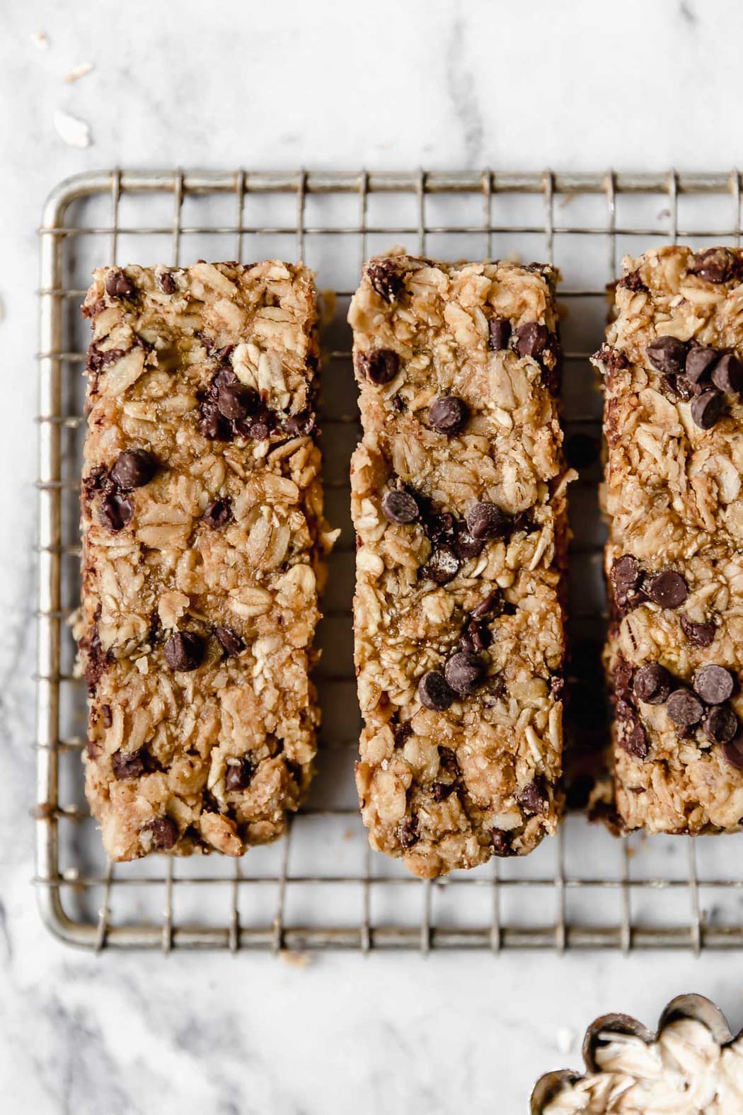 overhead picture of chocolate chip peanut butter granola bars on wire cooling rack