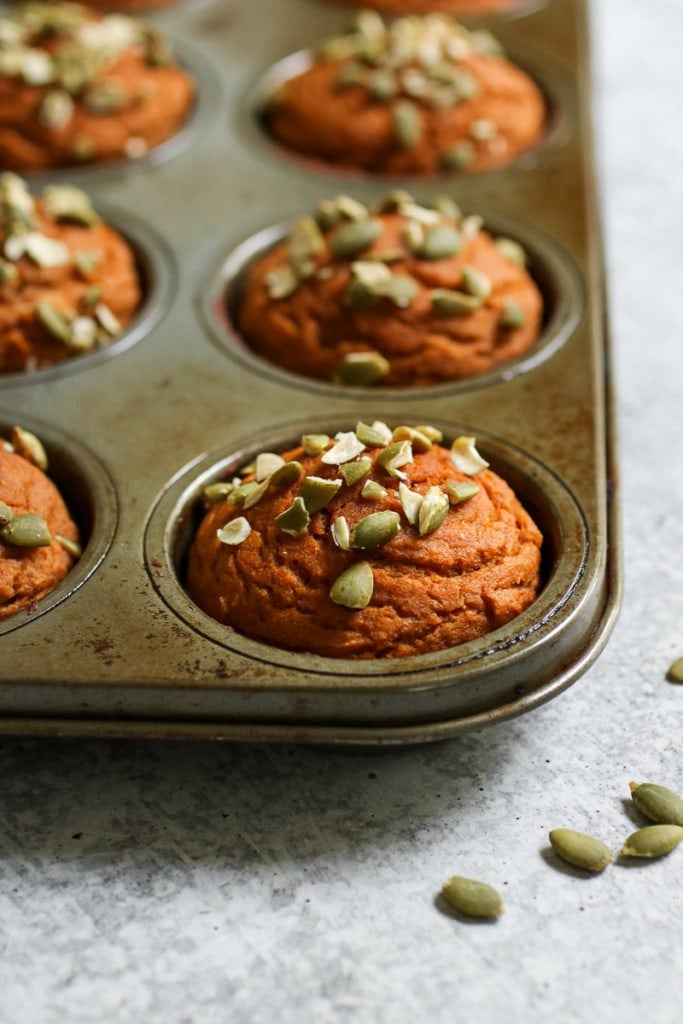 close up view of a pan of Pumpkin Protein Muffins