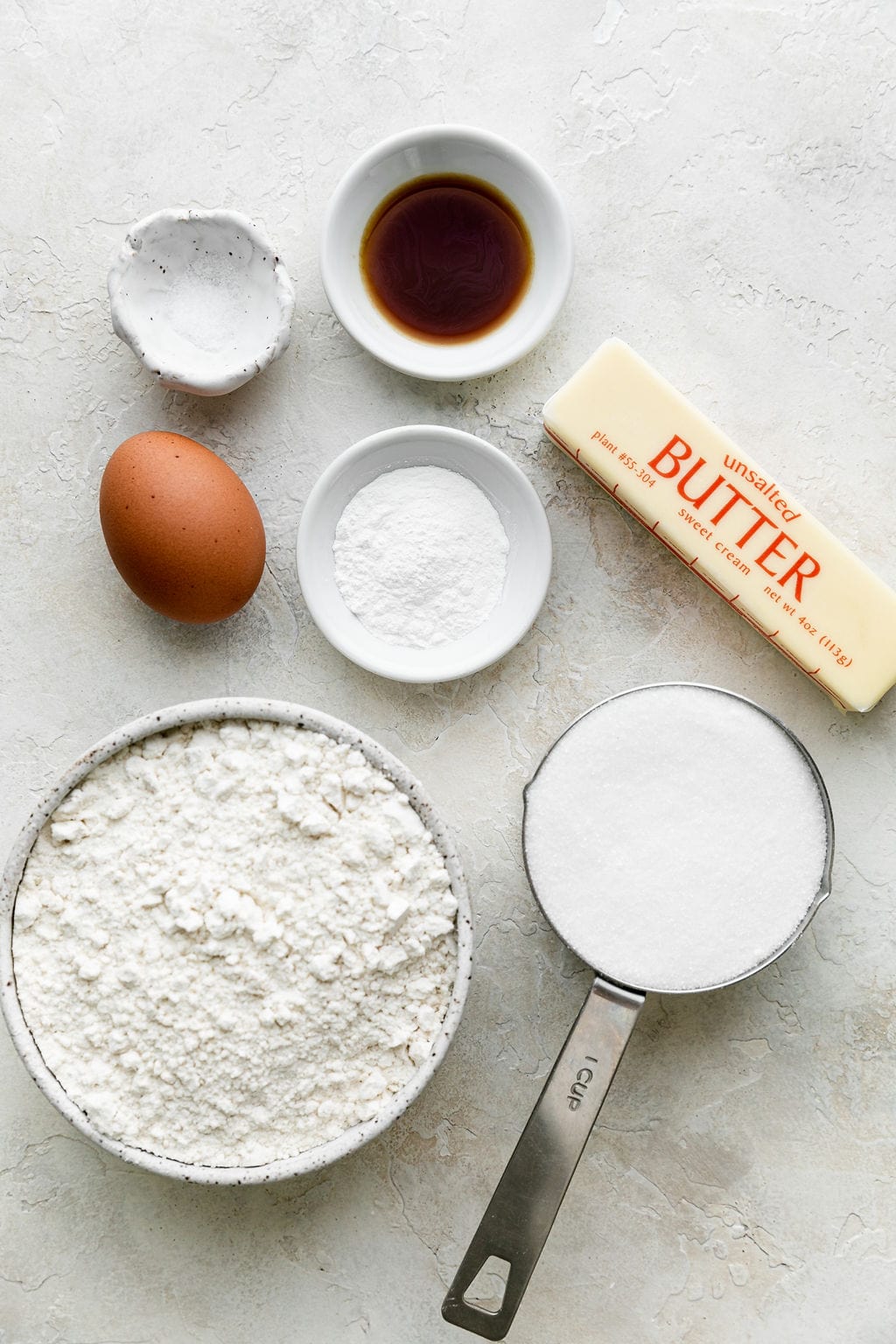 All ingredients for homemade sugar cookies arranged together on the counter