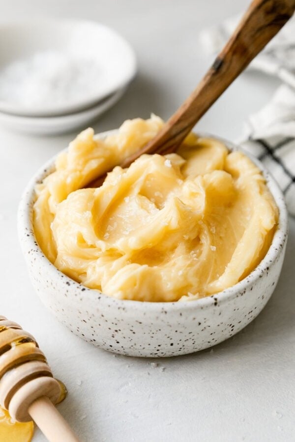 close up view of a small dish of honey butter