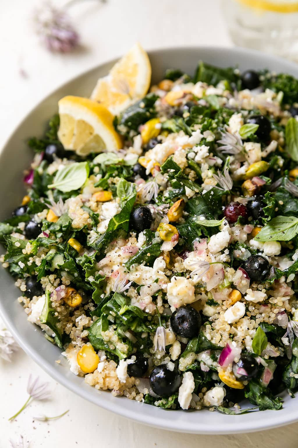 Quinoa kale salad with blueberries, pistachios, and feta cheese crumbles. 