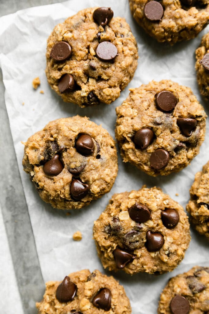 Overhead view of a sheet pan of Oatmeal Pumpkin Chocolate Chip Cookies