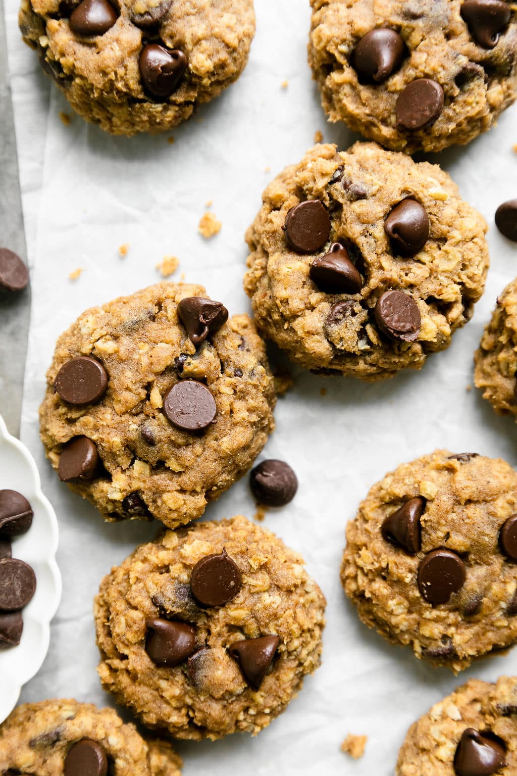Close up view of a sheet pan filled with Oatmeal Pumpkin Chocolate Chip Cookies