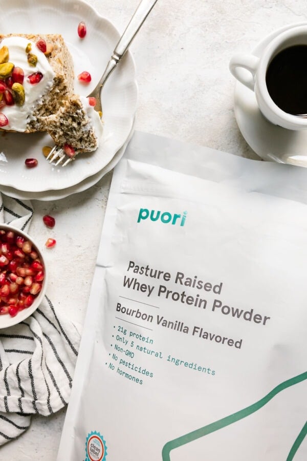 Overhead view of a bag of puori protein on a white marble countertop