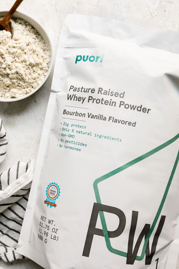 Overhead view of a bag of puori protein on a white countertop