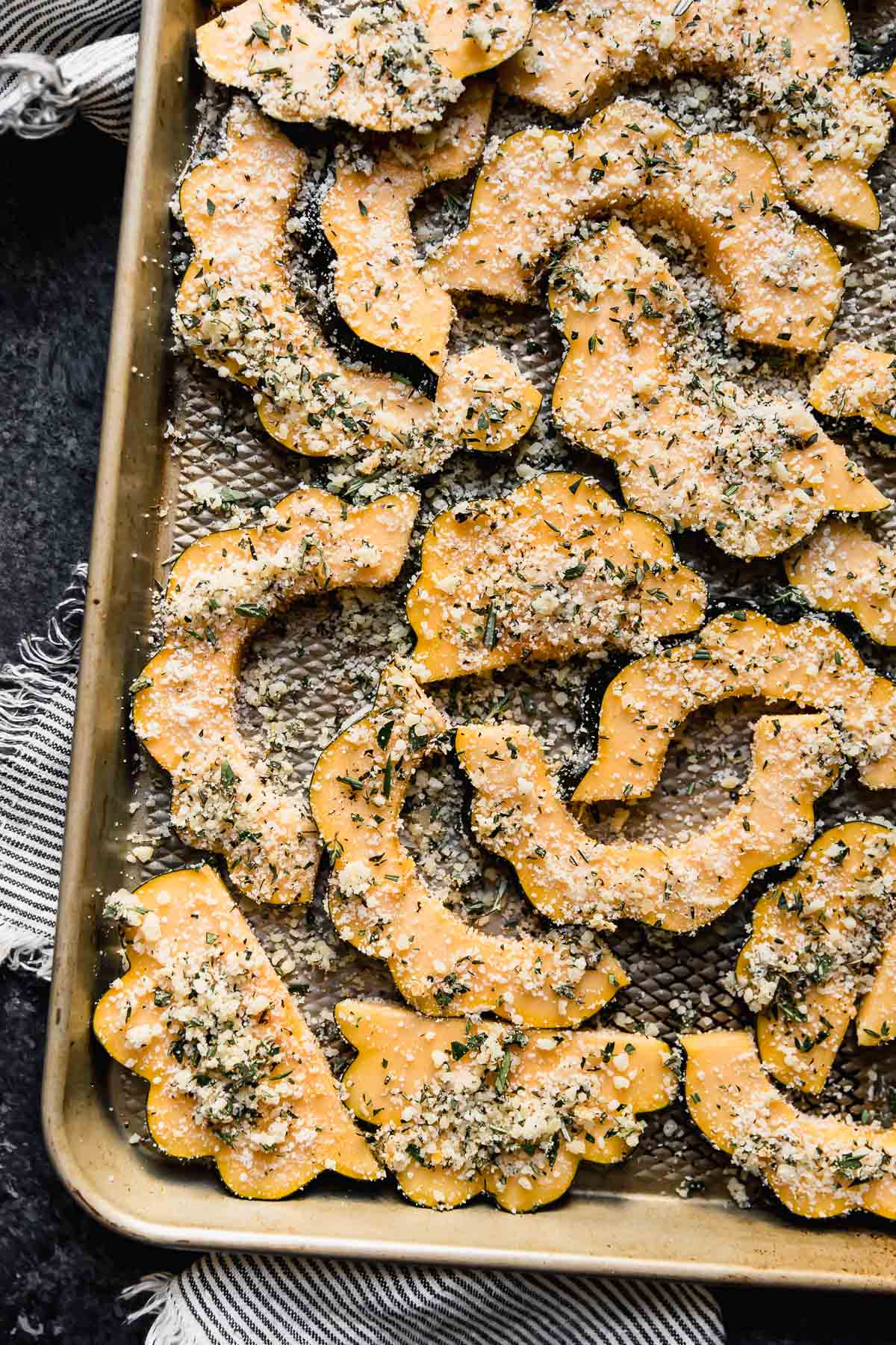 Parmesan crusted acorn squash recipe, shot from above, prepped and unbaked ingredients
