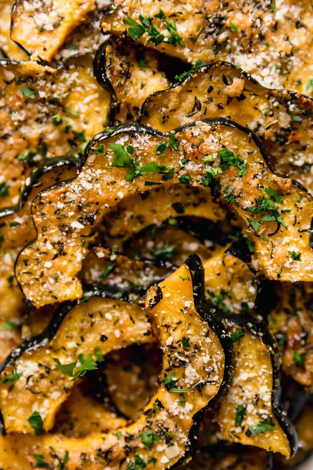 Herb-roasted Parmesan acorn squash recipe, close-up shot from above of finished items