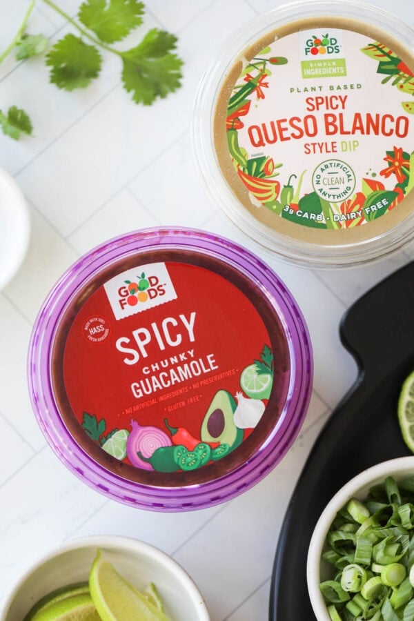 Close up overhead view container of Spicy guacamole from Good Foods.