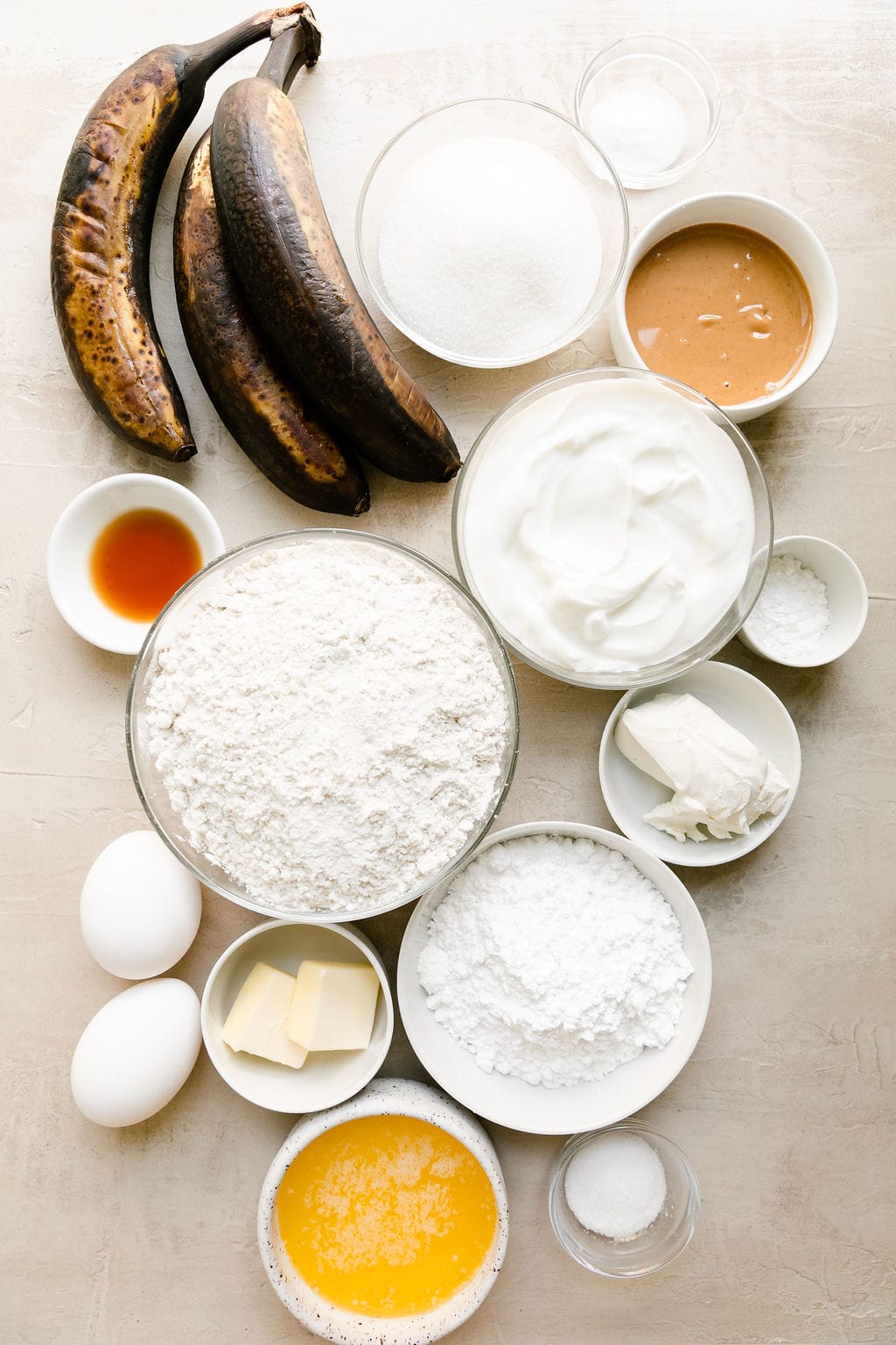 Overhead view all ingredients for banana cake with peanut butter frosting.