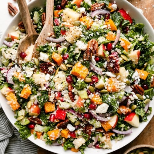 Overhead view white serving bowl filled with harvest quinoa salad with butternut squash