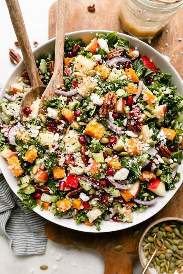 Overhead view white serving bowl filled with harvest quinoa salad with butternut squash