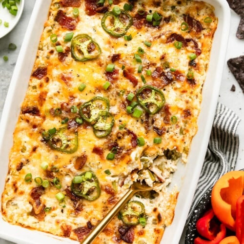white baking dish filled with jalapeno popper dip