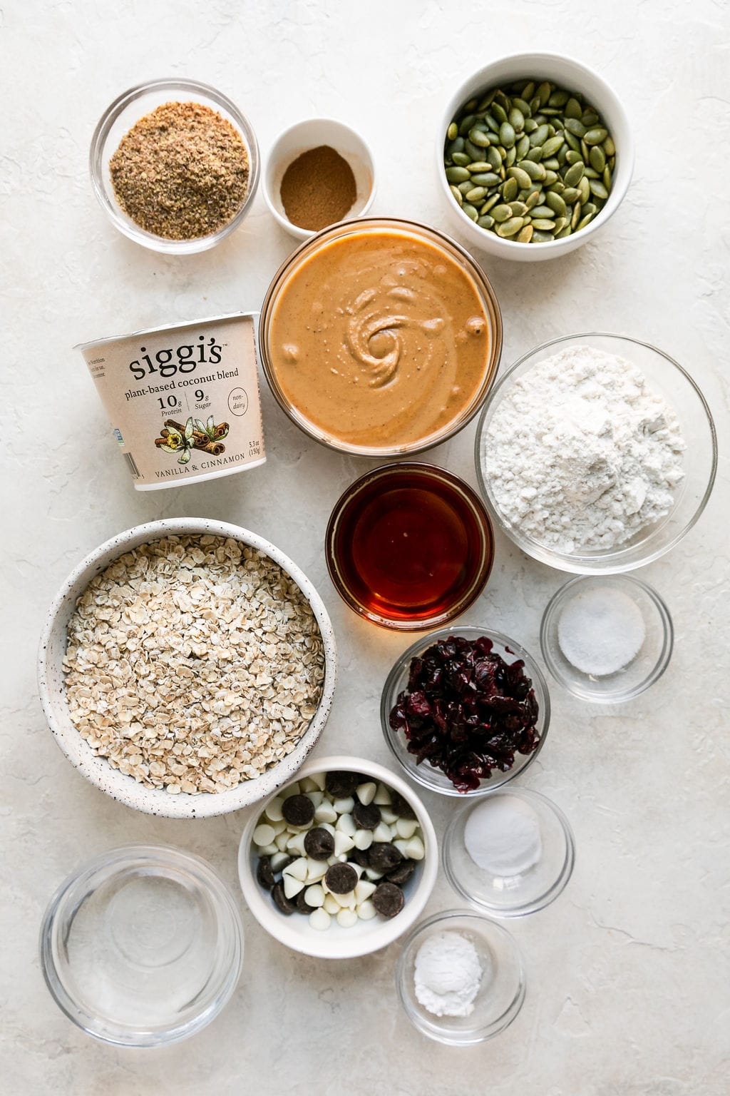 Overhead view all ingredients for trail mix breakfast cookies arranged together on counter.