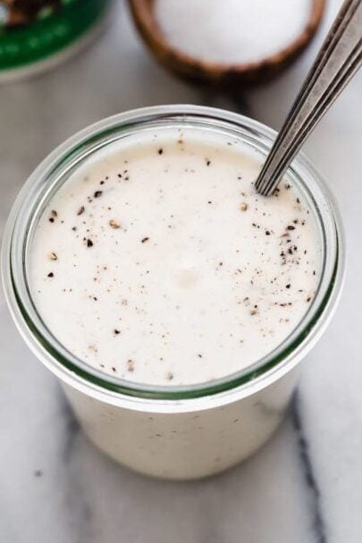 Yogurt dressing for creamy broccoli salad in small glass jar