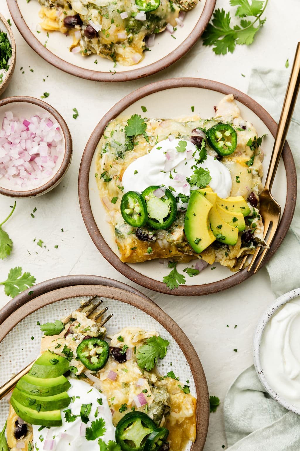 Overhead view plate with serving of green chicken enchilada casserole