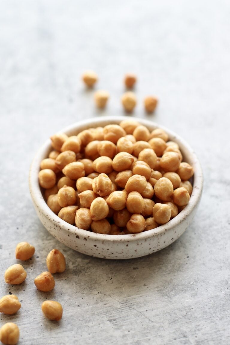 Close up view of a small bowl of roasted chickpeas.