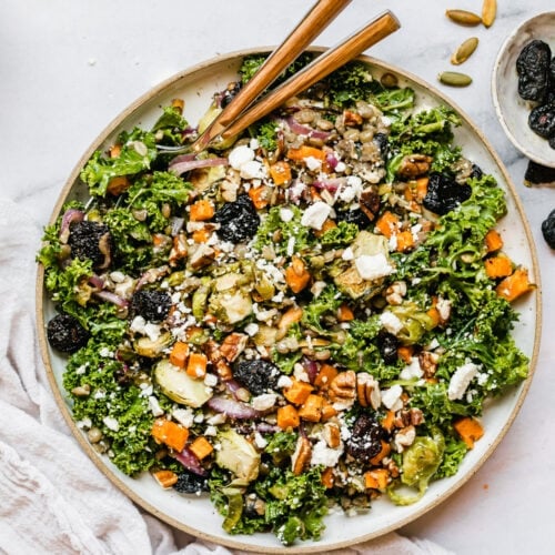 Overhead view serving bowl filled with lentil salad with roasted vegetables