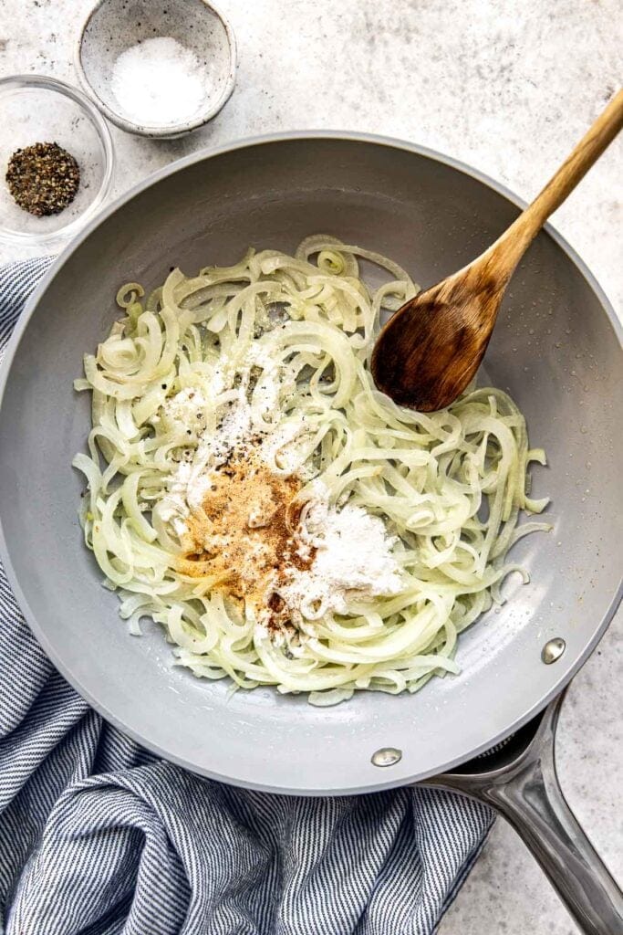 Skillet with sautéed onions, flour and spices.