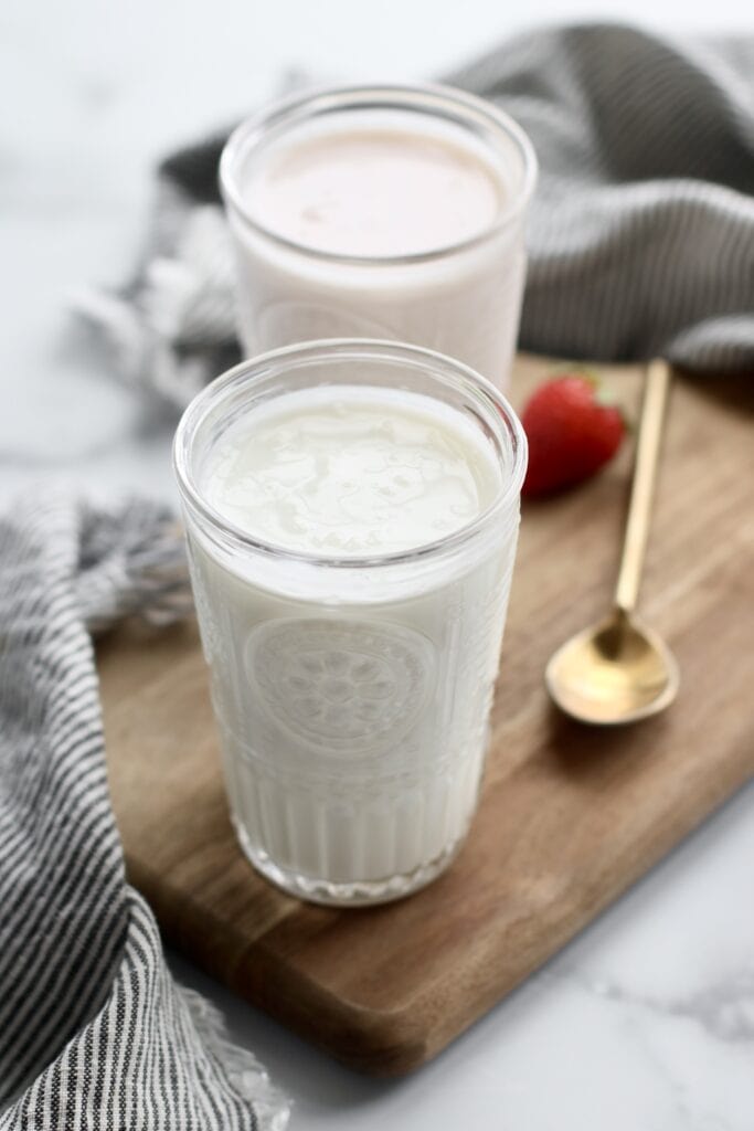 Close up view of a glass of kefir.