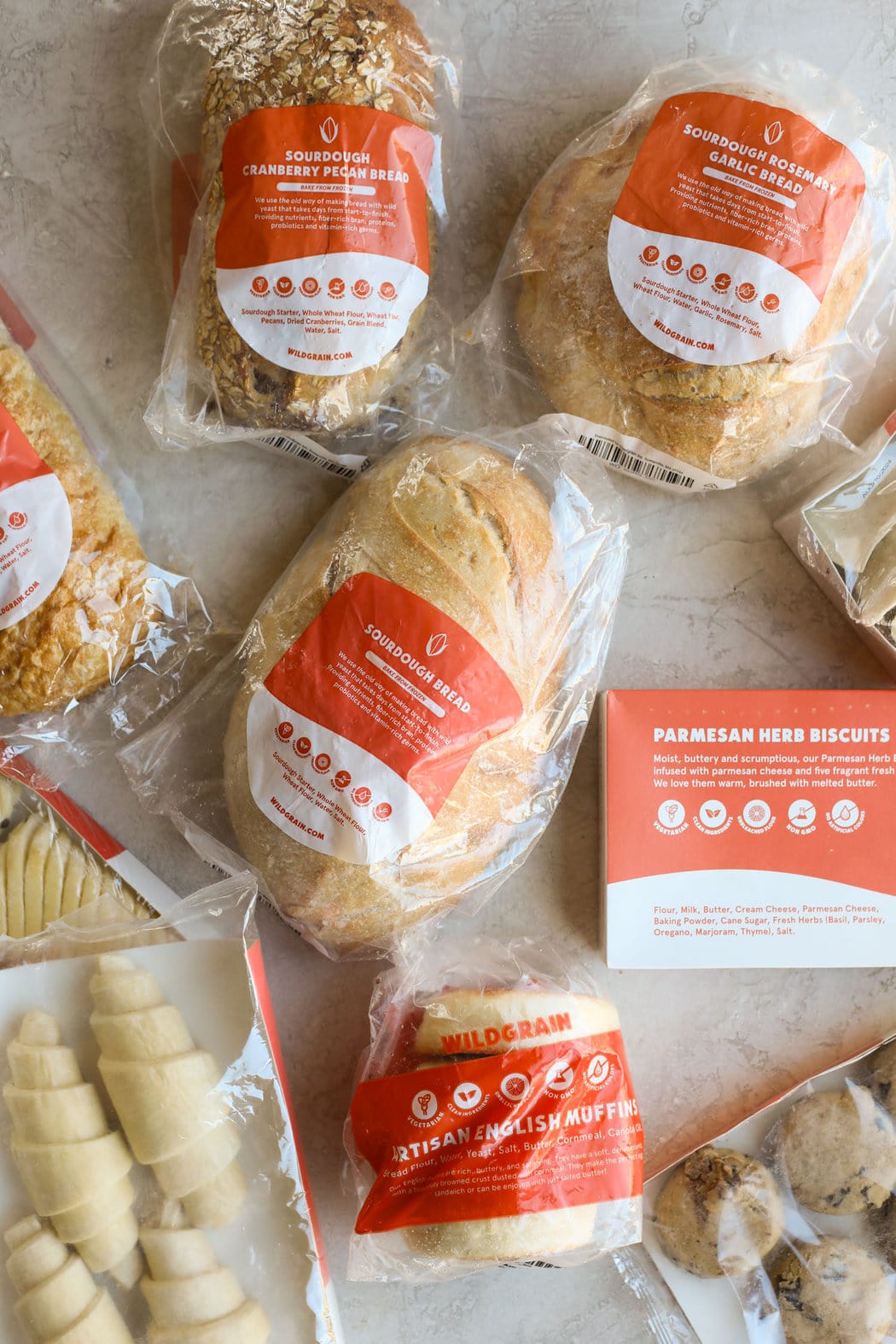 Overhead view of sourdough bread loaves and products. 