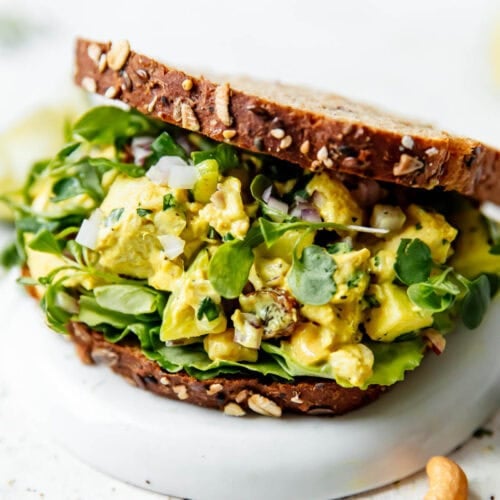 A sandwich filled with Curry Chicken Salad