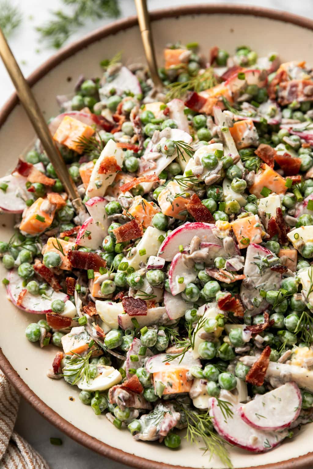 Close up of Creamy Pea Salad in a white bowl