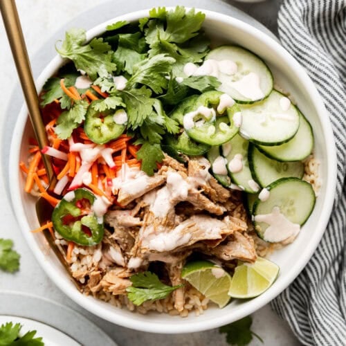 Banh Mi bowl topped with sauce and veggies