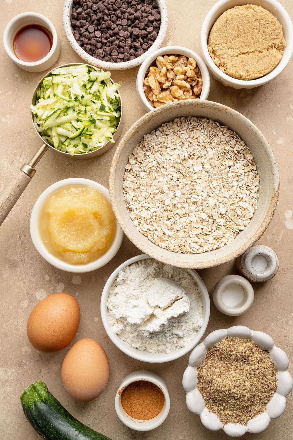 Ingredients needed to make oatmeal zucchini breakfast cookies with chocolate chips.