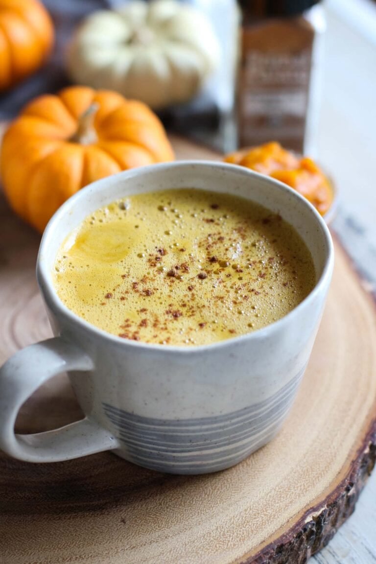 Close up view of a cup of pumpkin spice butter coffee topped with cinnamon.