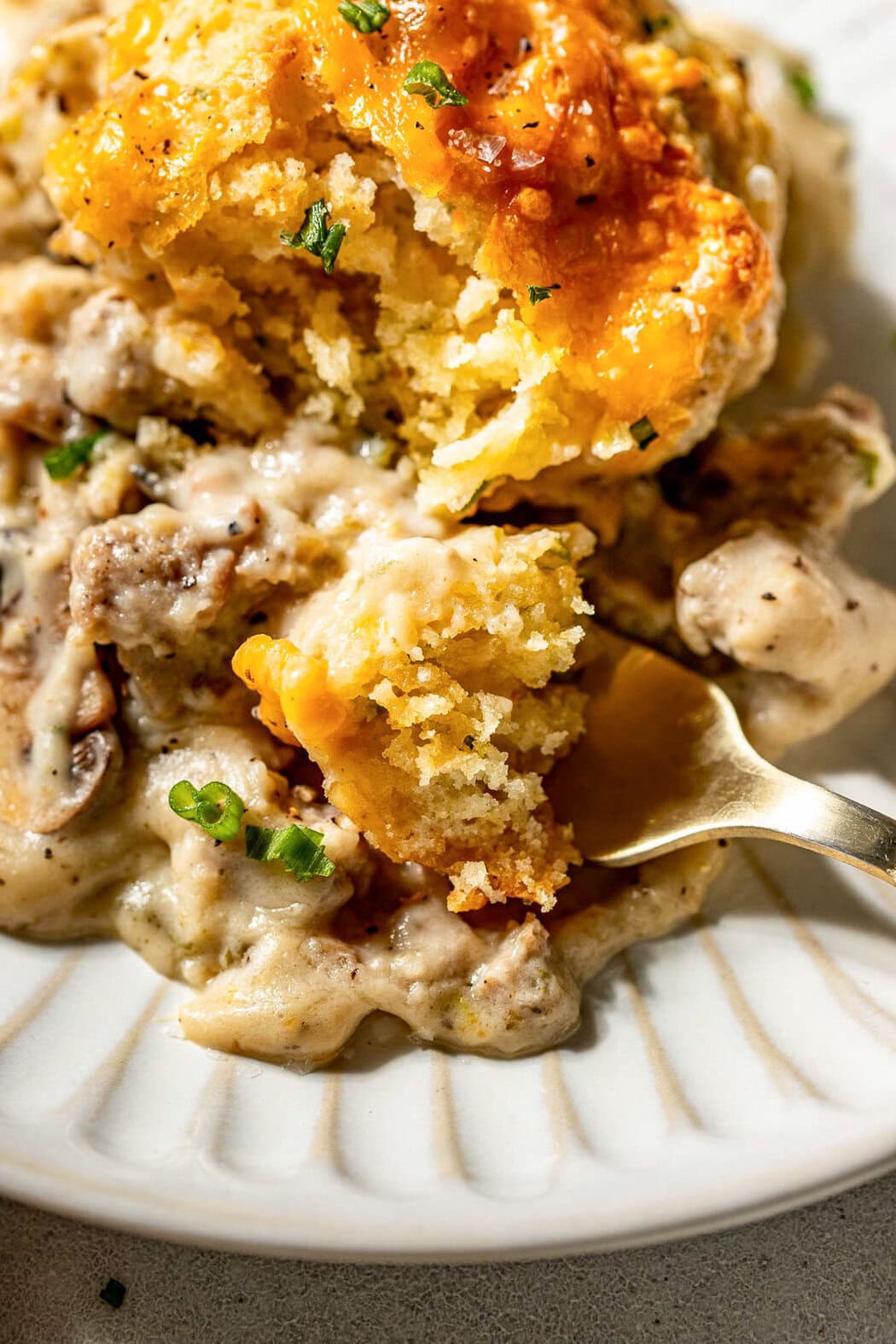 Close up view of a plate of Biscuits And Gravy Casserole