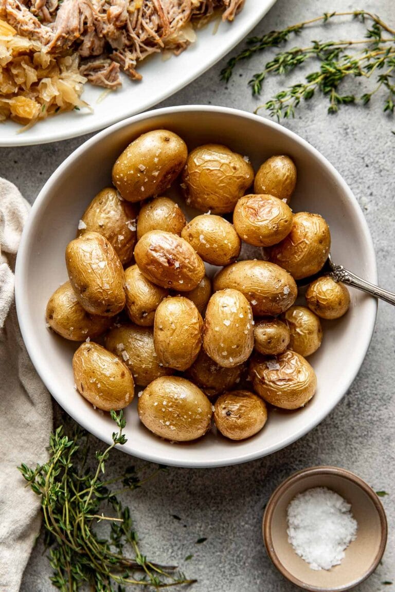 Overhead view of a shallow bowl of roasted baby potatoes. 