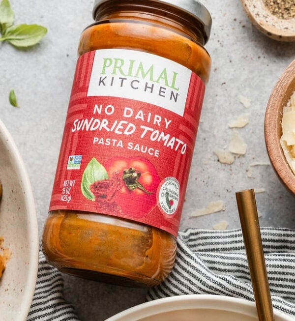 A jar of primal kitchen sun dried tomato sauce