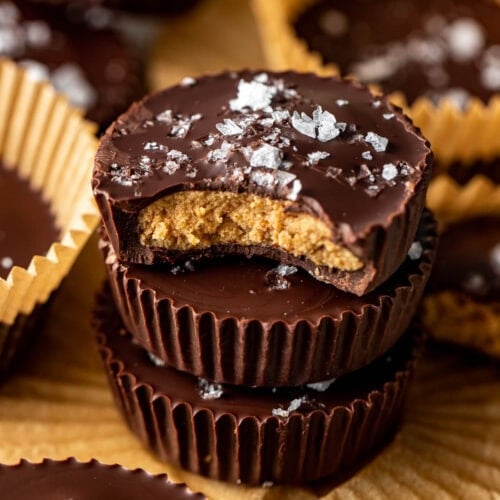A close up stack of Peanut Butter Protein Cups topped with flakey sea salt