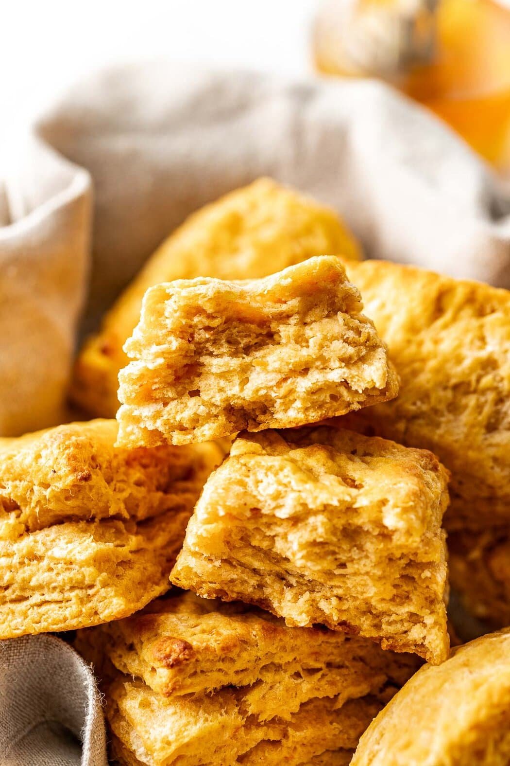 A sweet potato biscuit that has been torn in half to reveal loads of flaky layers.