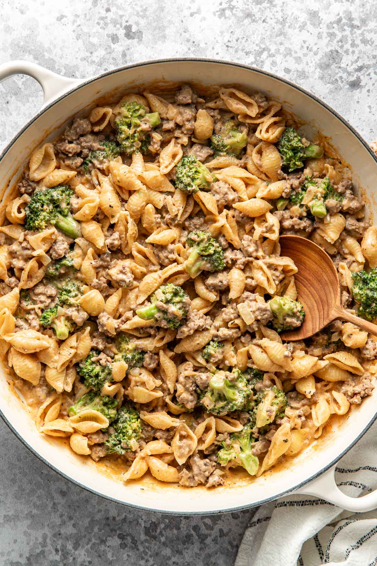 Overhead view of a white skillet filled with Homemade Hamburger Helper topped with black pepper. 