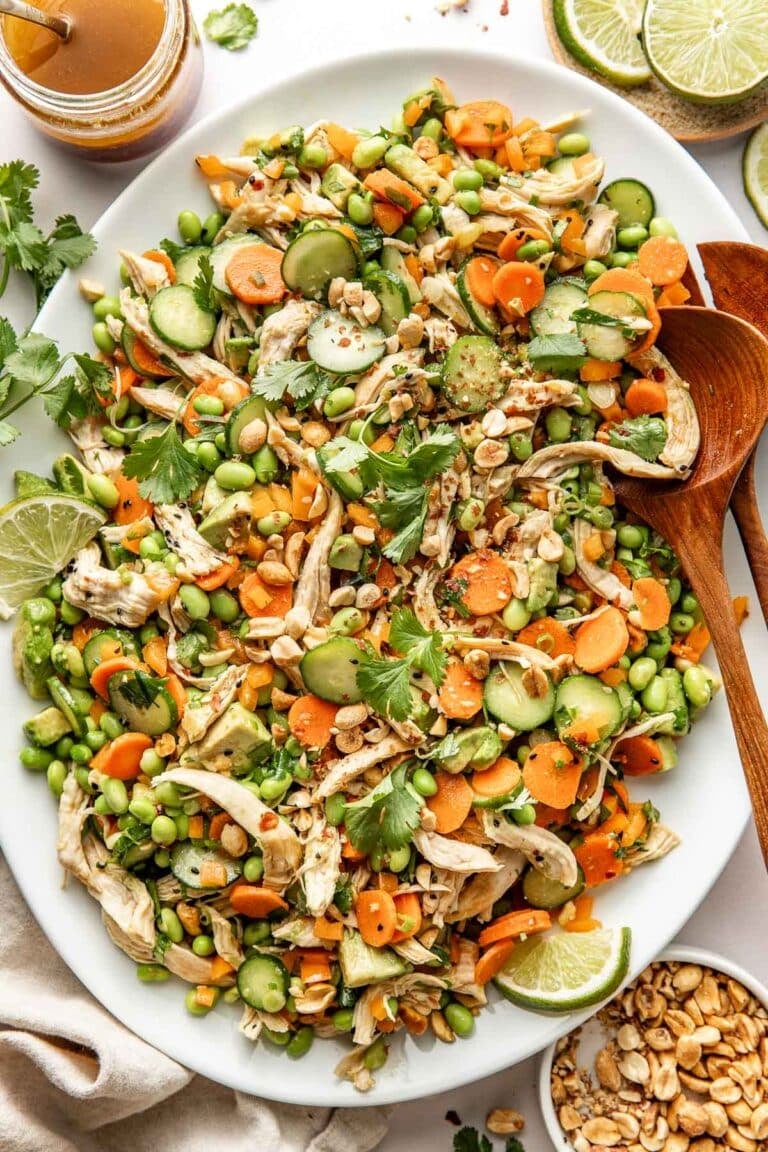 Thai chicken salad served over a white platter. 