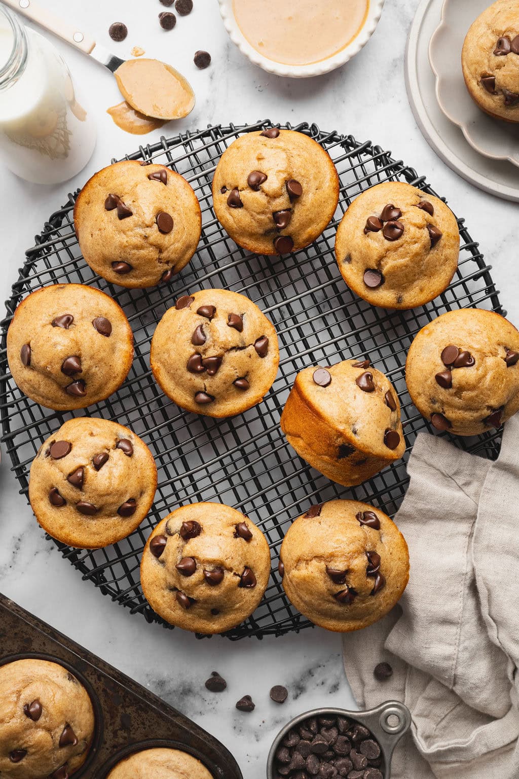 Overhead view of Peanut Butter Protein Muffins on a wire cooling rack. 