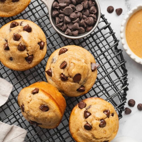 Overhead view of Peanut Butter Protein Muffins on a wire cooling rack.
